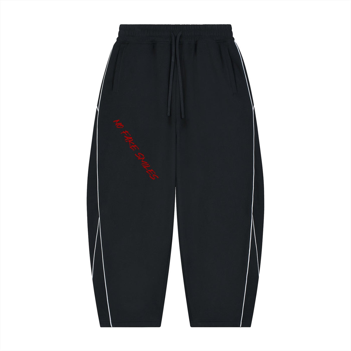 No Fake Smiles black fleece sweatpants with white piping, barrel leg silhouette, and red slanted text graphic.