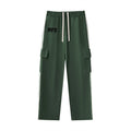 No Fake Smiles dark green straight-leg athleisure pants with side contrast webbing, cargo pockets, and drawstring waist.