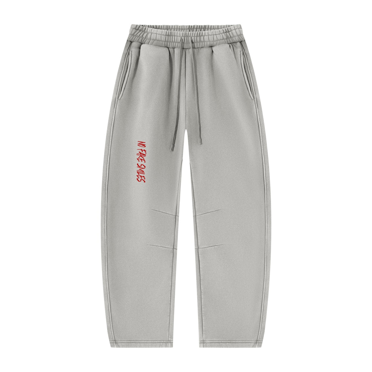 No Fake Smiles grey vintage wash fleece sweatpants with a relaxed barrel-leg fit and red graphic text on the thigh.