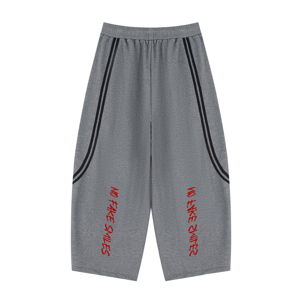 No Fake Smiles grey wide leg sweatpants with black piping detail and red graphic text on the front