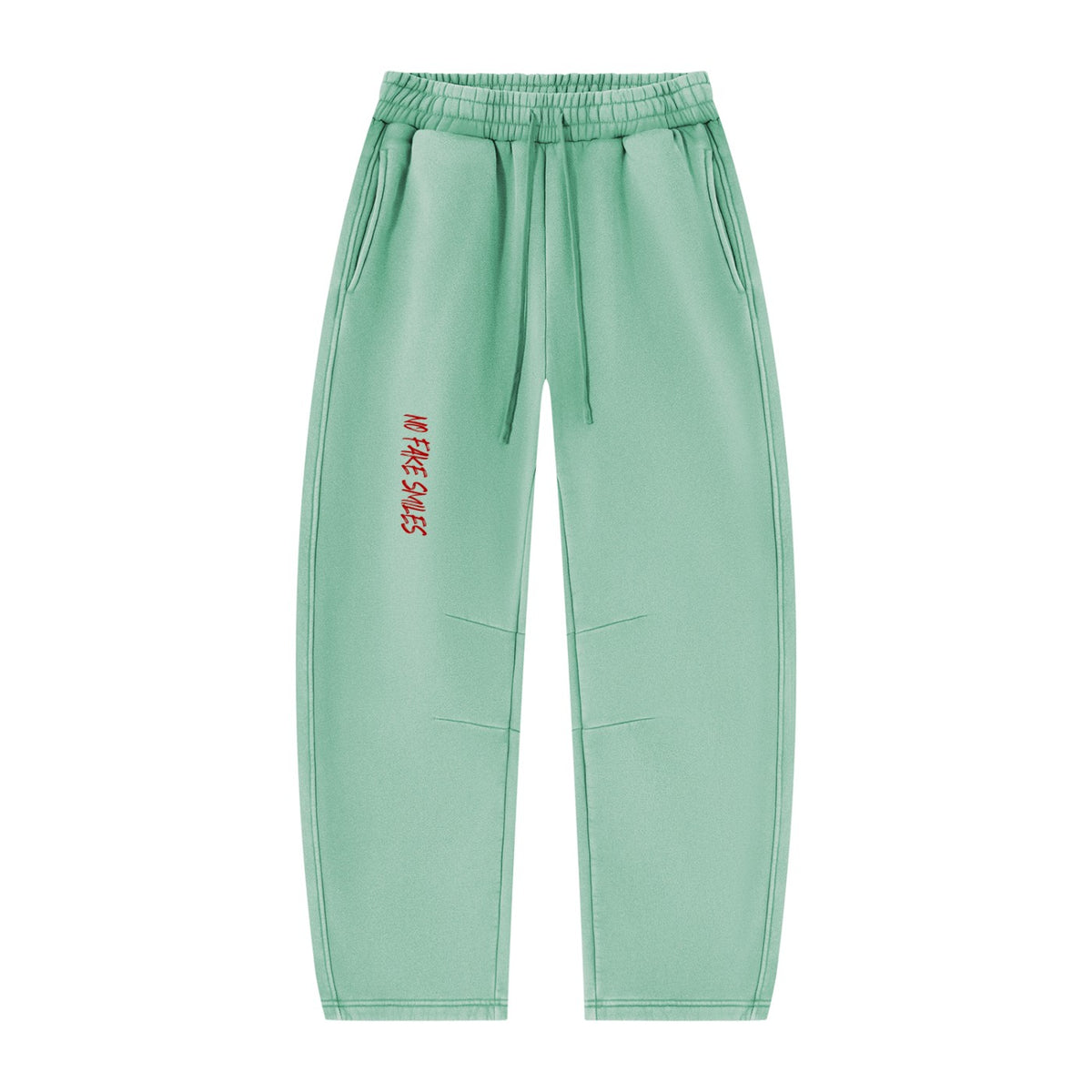 No Fake Smiles vintage wash mint green fleece sweatpants with a relaxed barrel-leg fit and red graphic logo detail.