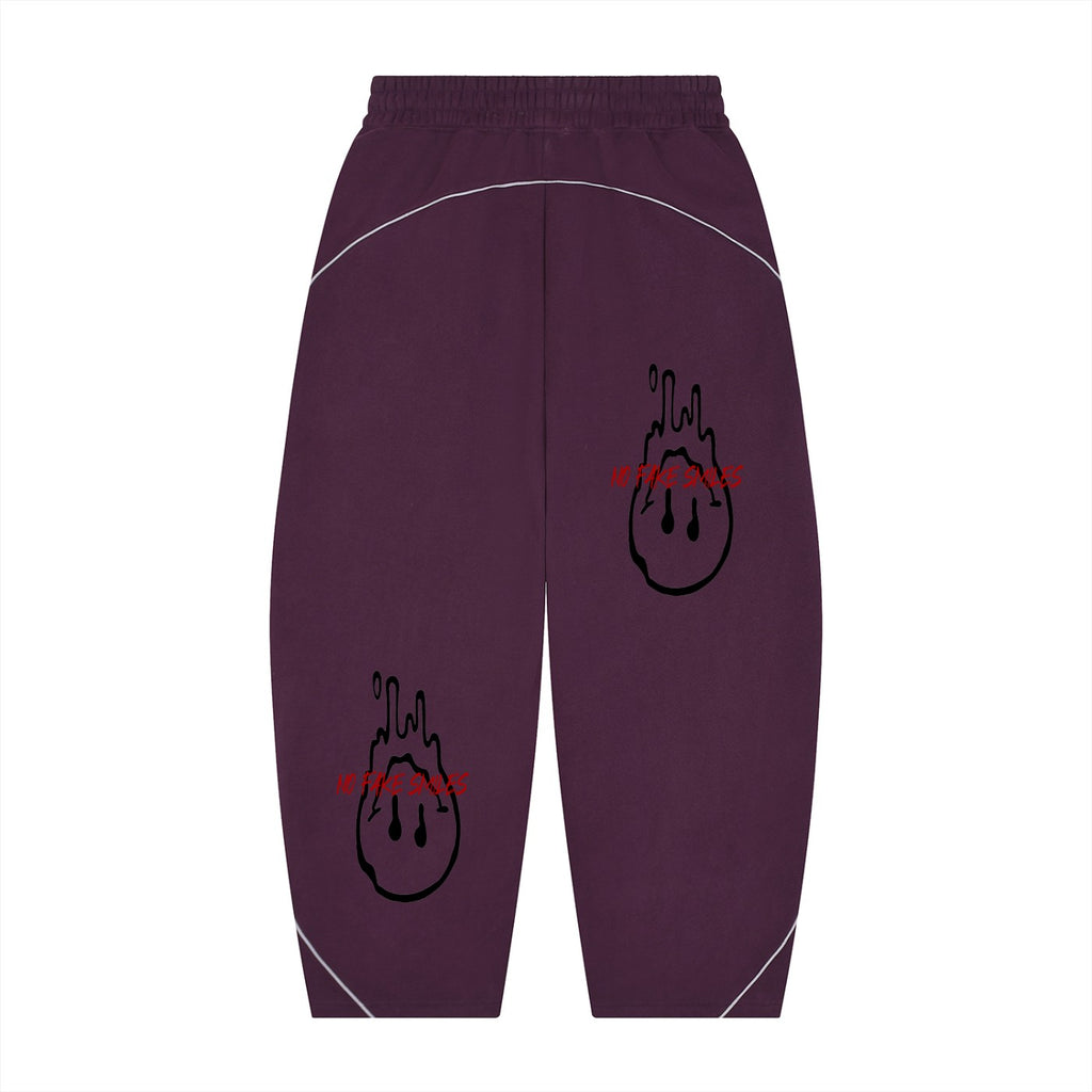 No Fake Smiles purple fleece sweatpants with barrel leg silhouette, white piping, and red dripping smiley face print.