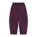 No Fake Smiles purple fleece barrel leg sweatpants with white piping details and red slanted letter graphic print.