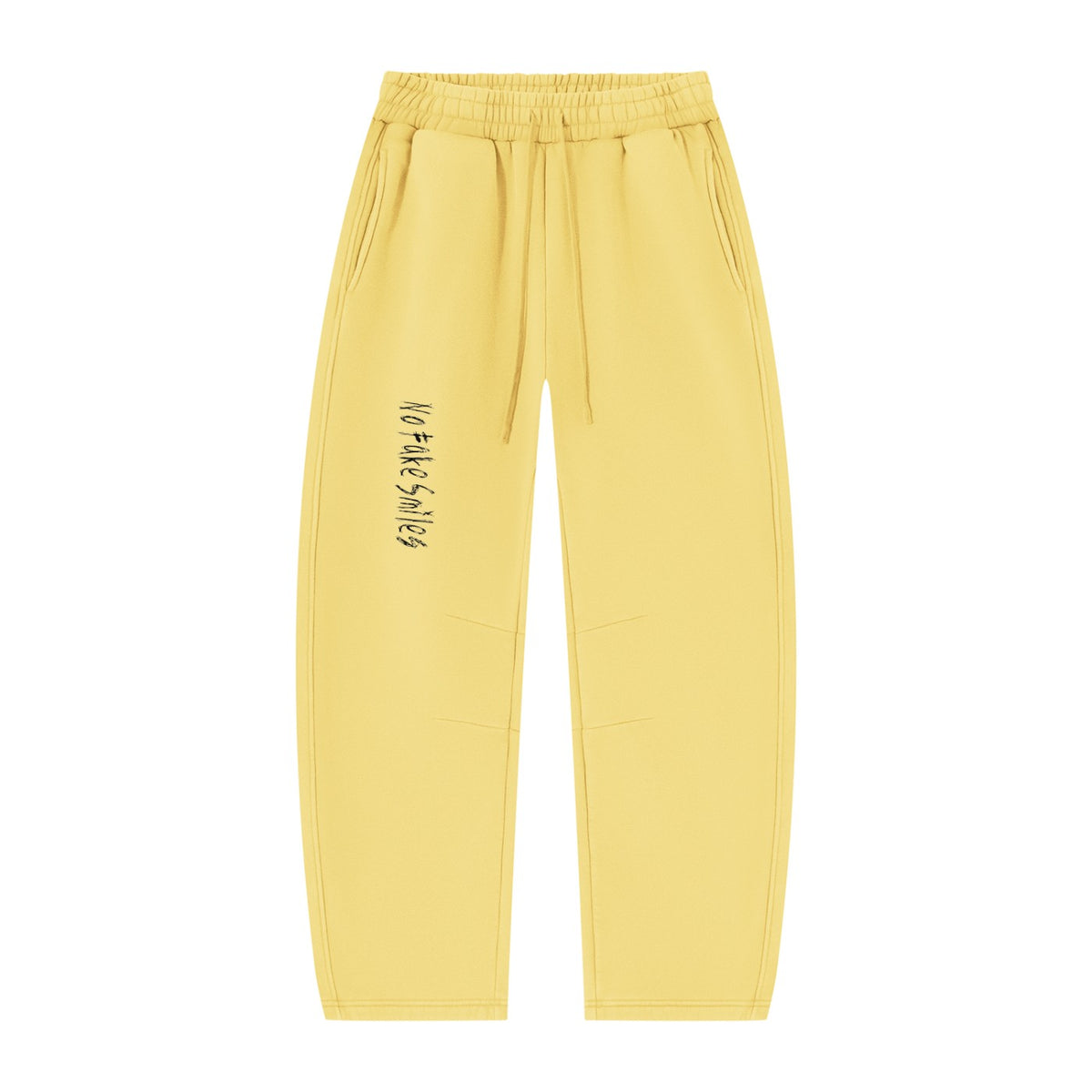 No Fake Smiles yellow fleece sweatpants with a vintage wash, barrel leg silhouette, drawstring waist, and side pockets.