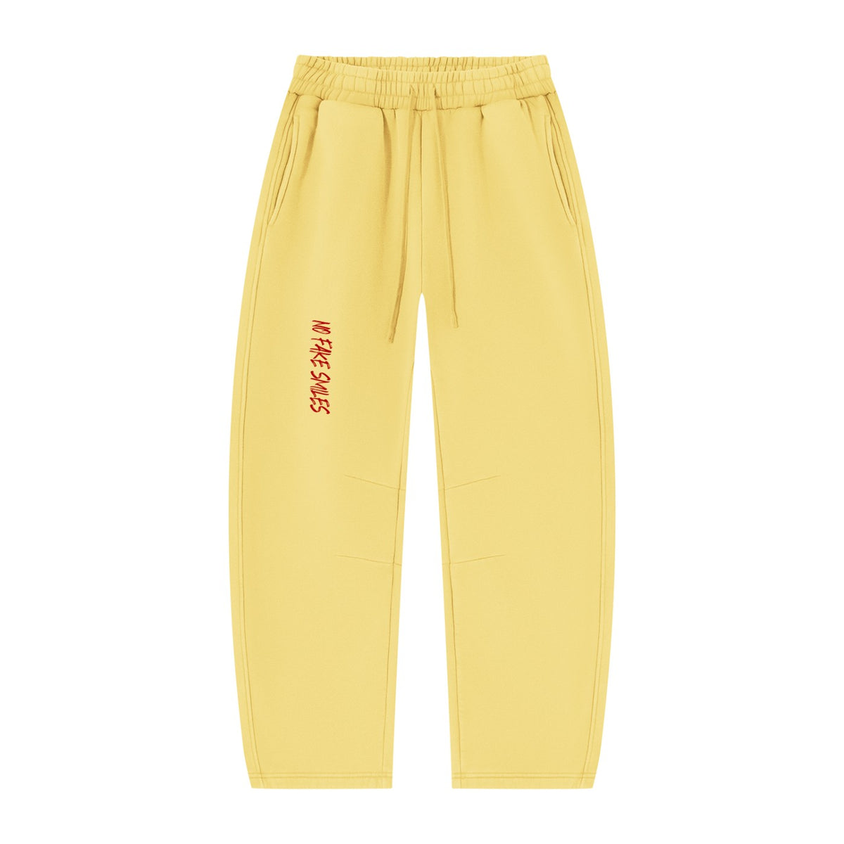 No Fake Smiles yellow vintage wash fleece sweatpants with a relaxed barrel-leg fit and red graphic logo detail.